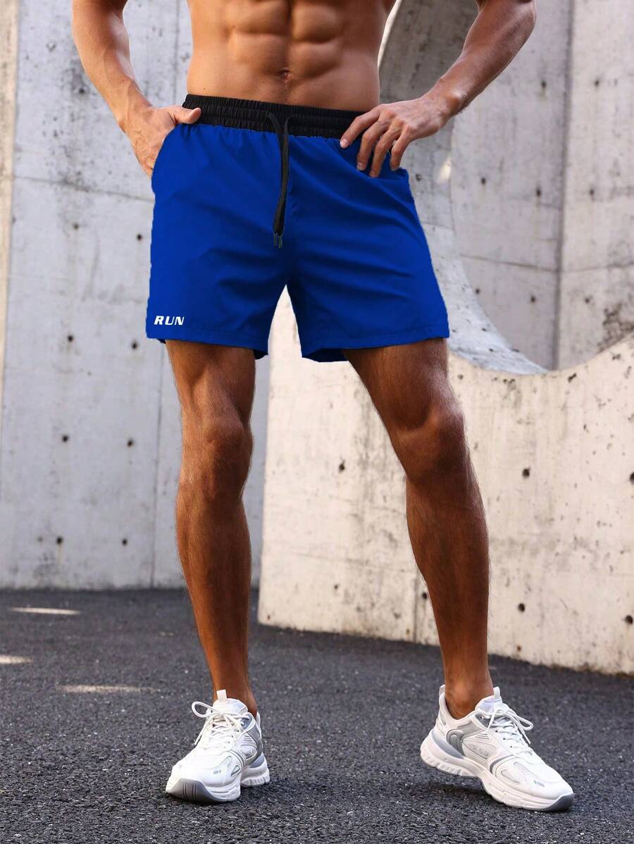Shorts de sport avec taille élastique, poches larges et inscription