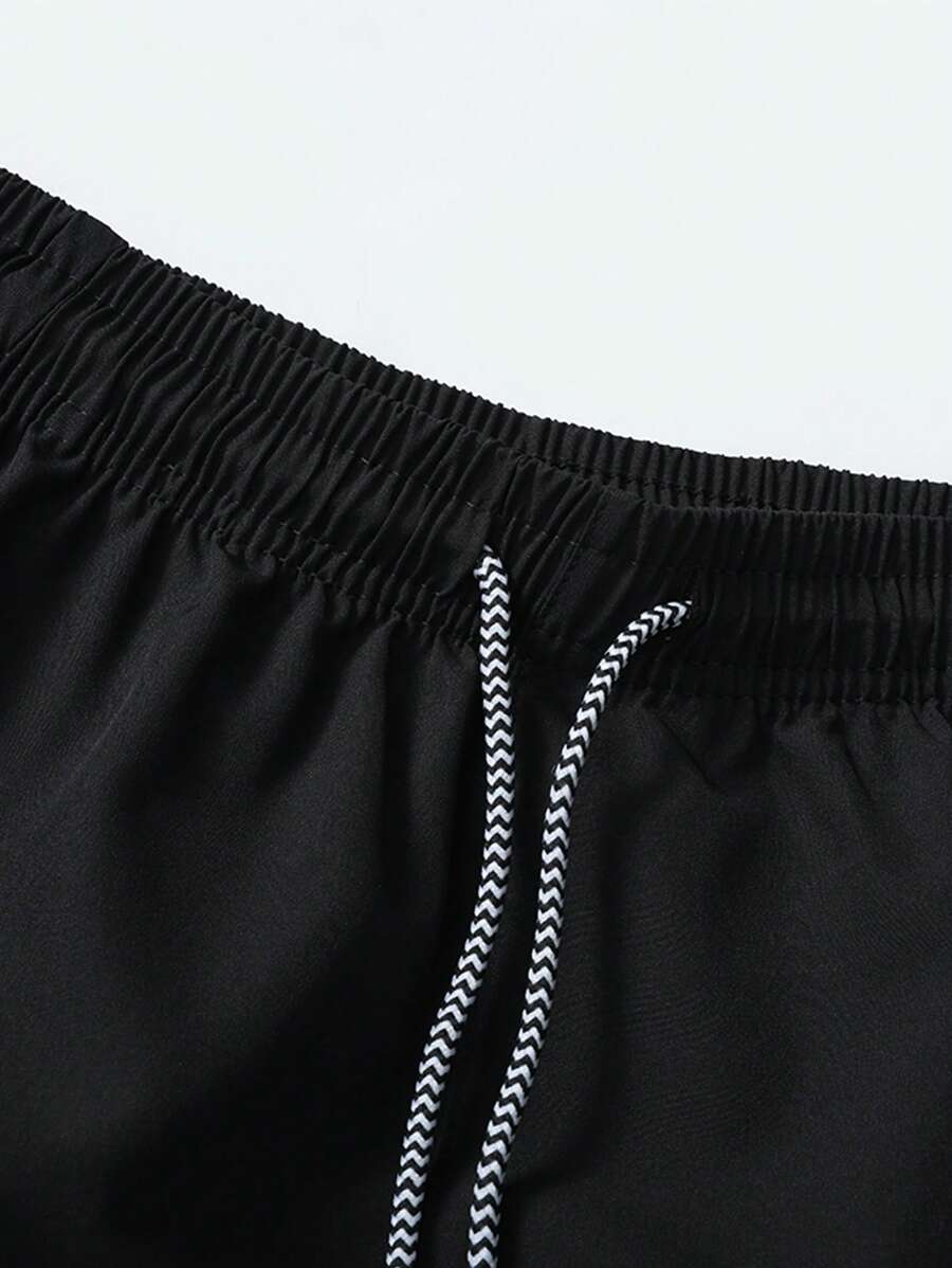 Shorts de sport taille élastique avec poches zippées et cordon
