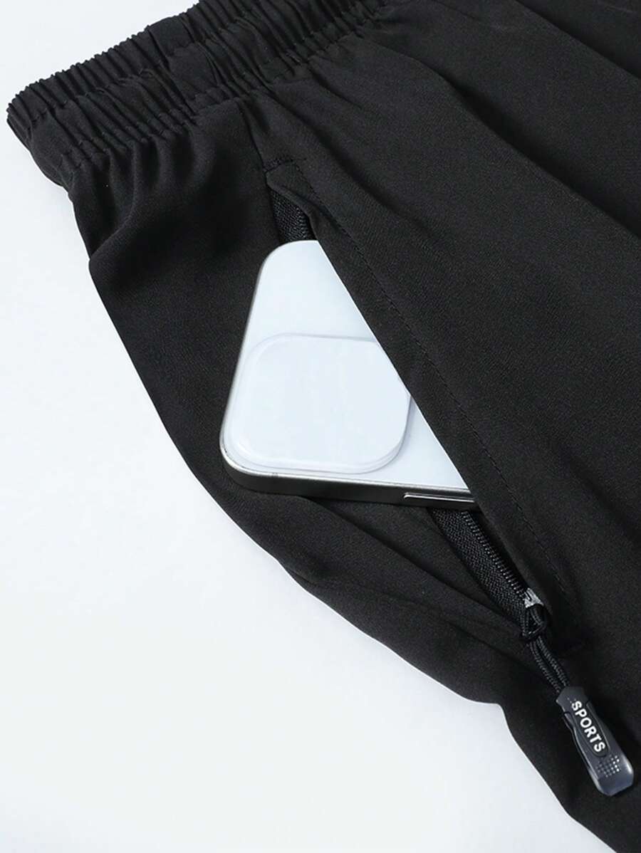 Shorts de sport taille élastique avec poches zippées et cordon
