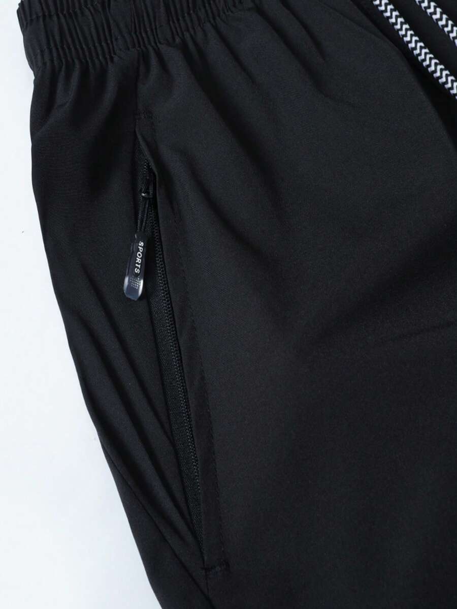 Shorts de sport taille élastique avec poches zippées et cordon