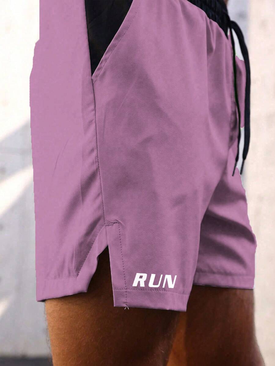 Shorts de sport avec taille élastique, poches larges et inscription
