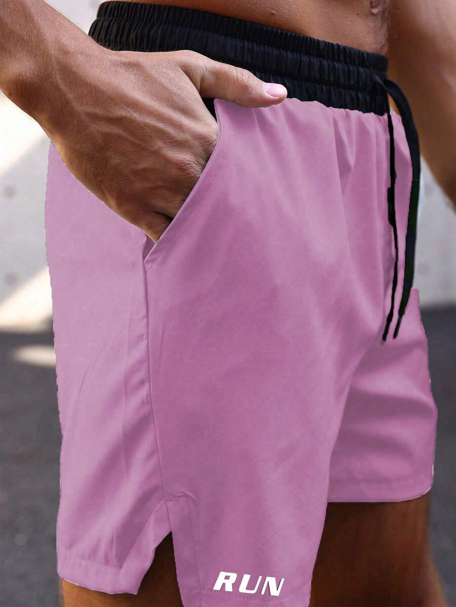 Shorts de sport avec taille élastique, poches larges et inscription