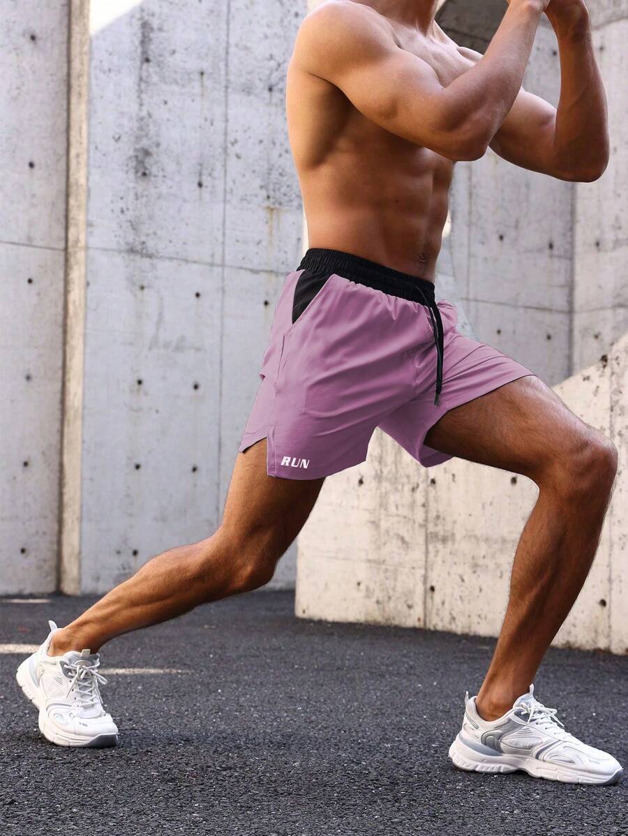 Shorts de sport avec taille élastique, poches larges et inscription