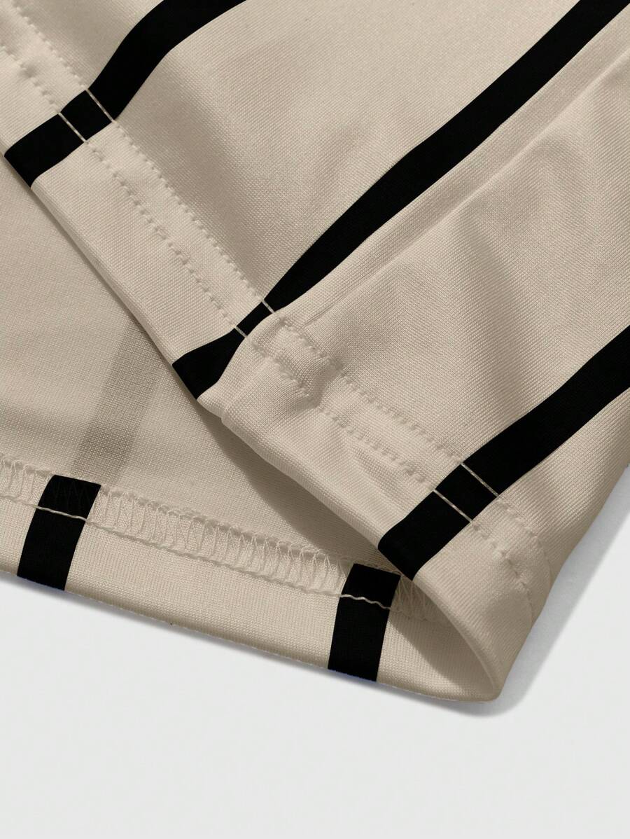 Chemise décontractée à manches courtes et rayures, col rond et coupe ample