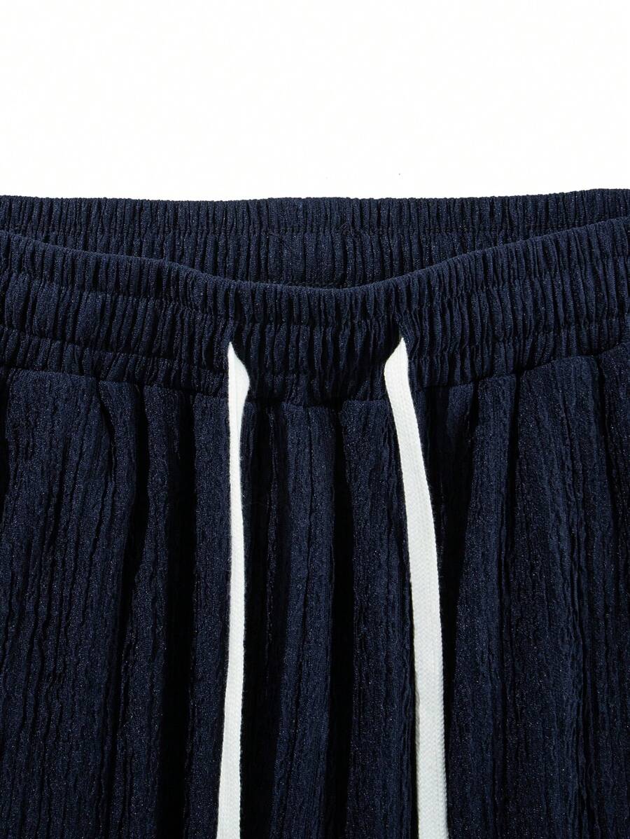 Pantalon droit décontracté en tissu froissé de couleur unie pour homme