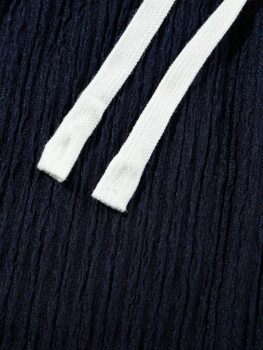 Pantalon droit décontracté en tissu froissé de couleur unie pour homme