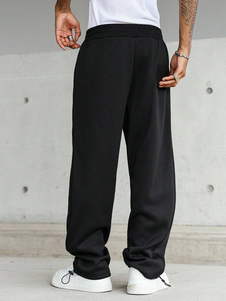Pantalon droit athlétique ultra-ample à la mode avec cordon de serrage pour homme
