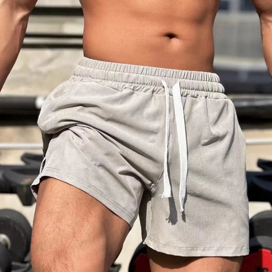 Shorts de sport larges avec taille élastique et cordon tendance