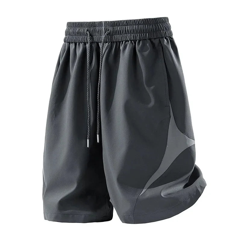 Short de sport décontracté à séchage rapide et coupe ample avec motif color block