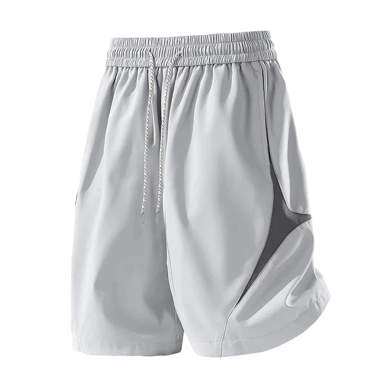 Short de sport décontracté à séchage rapide et coupe ample avec motif color block