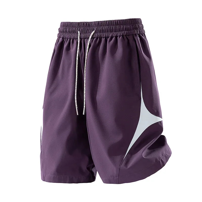 Short de sport décontracté à séchage rapide et coupe ample avec motif color block