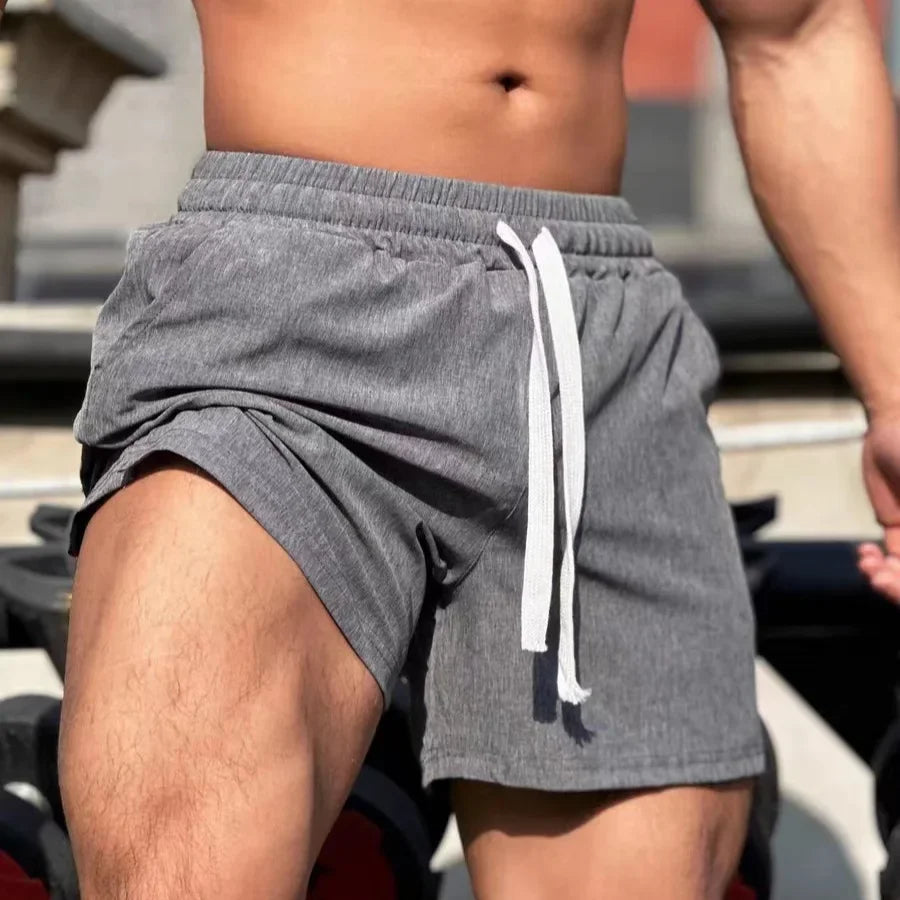 Shorts de sport larges avec taille élastique et cordon tendance