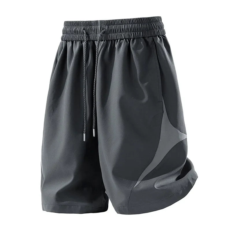 Short de sport décontracté à séchage rapide et coupe ample avec motif color block