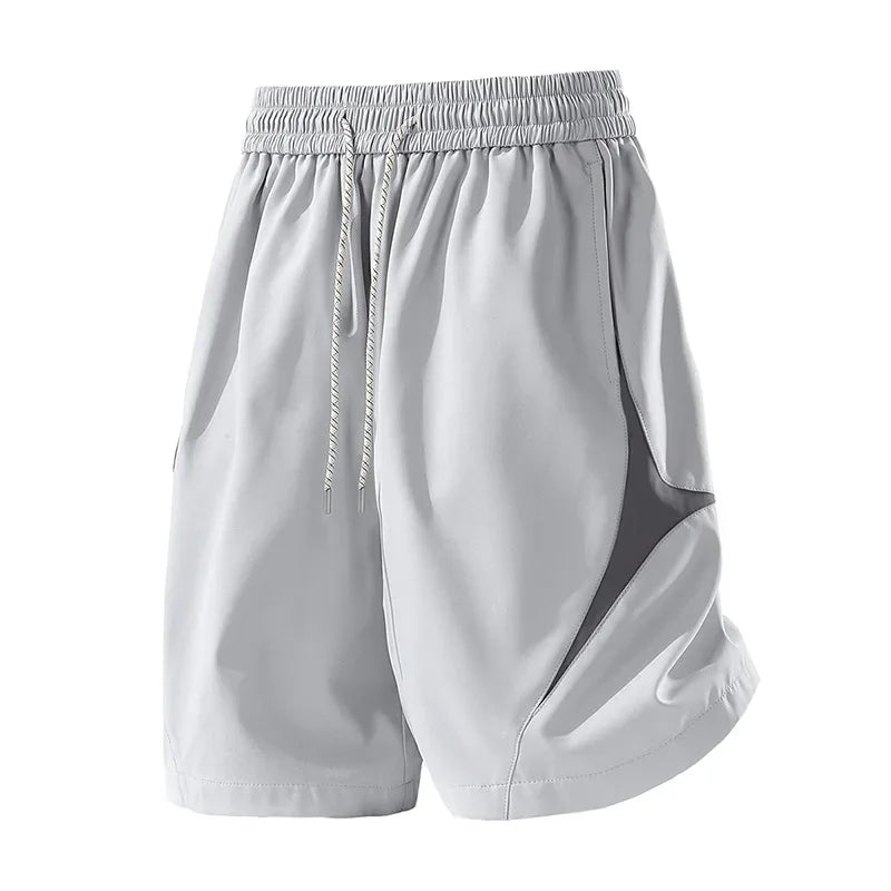 Short de sport décontracté à séchage rapide et coupe ample avec motif color block