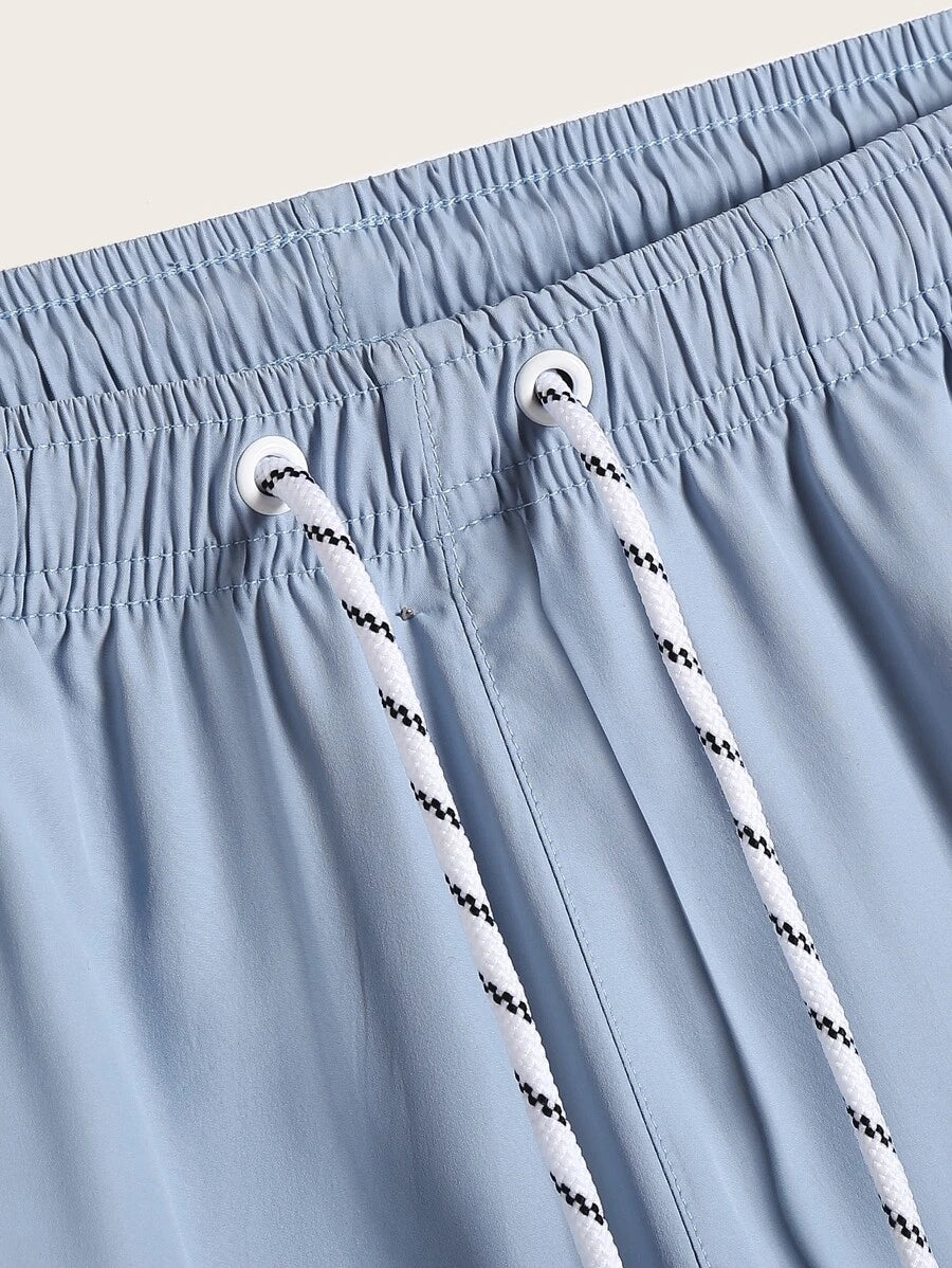 Short court décontracté de style plage avec cordon de serrage pour homme