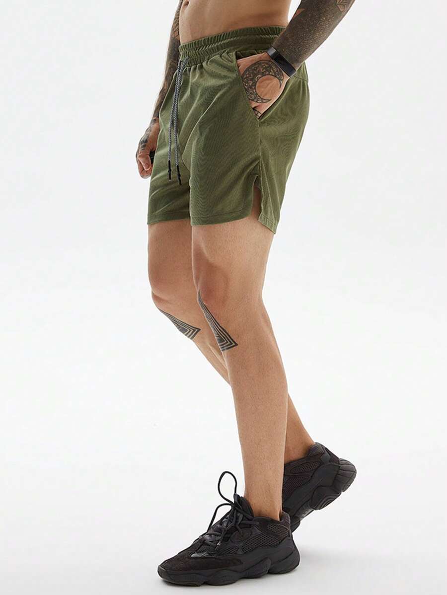 Shorts de sport avec fente, taille élastique et poche pour téléphone pour hommes