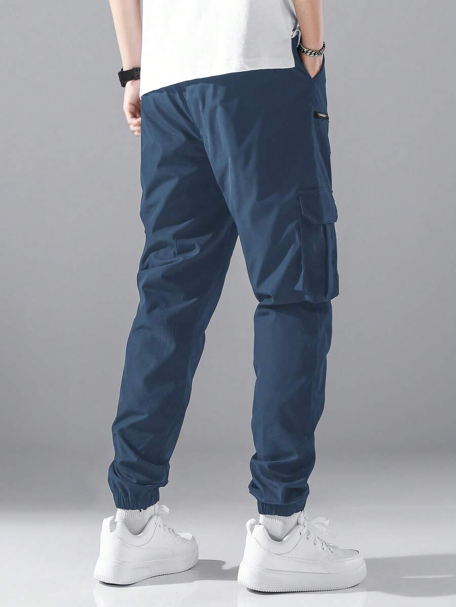 Pantalon cargo ample avec poches à rabat et cordons de serrage pour homme