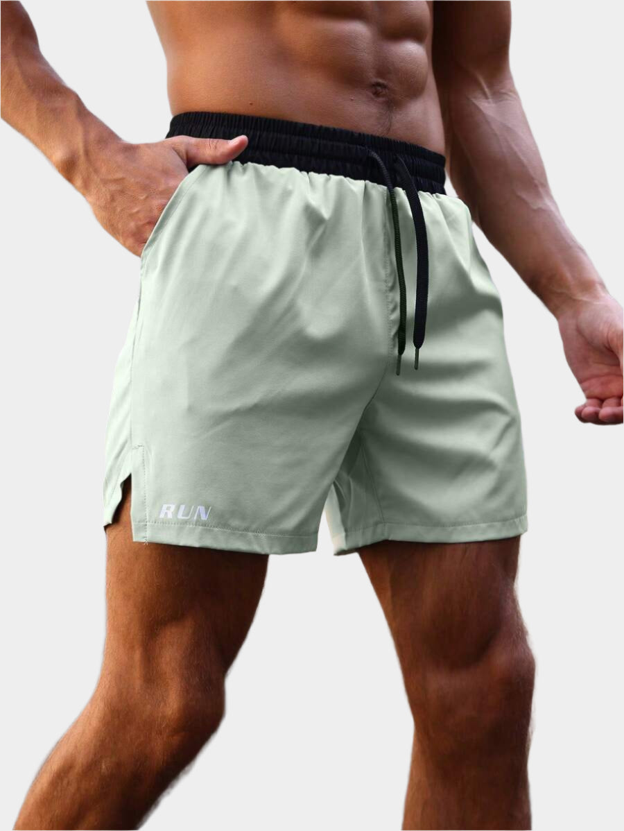 Shorts de sport avec taille élastique, poches larges et inscription