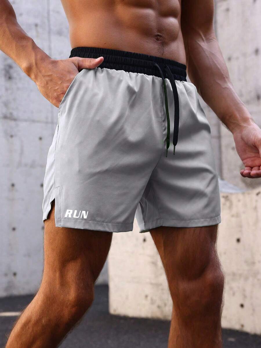 Shorts de sport avec taille élastique, poches larges et inscription