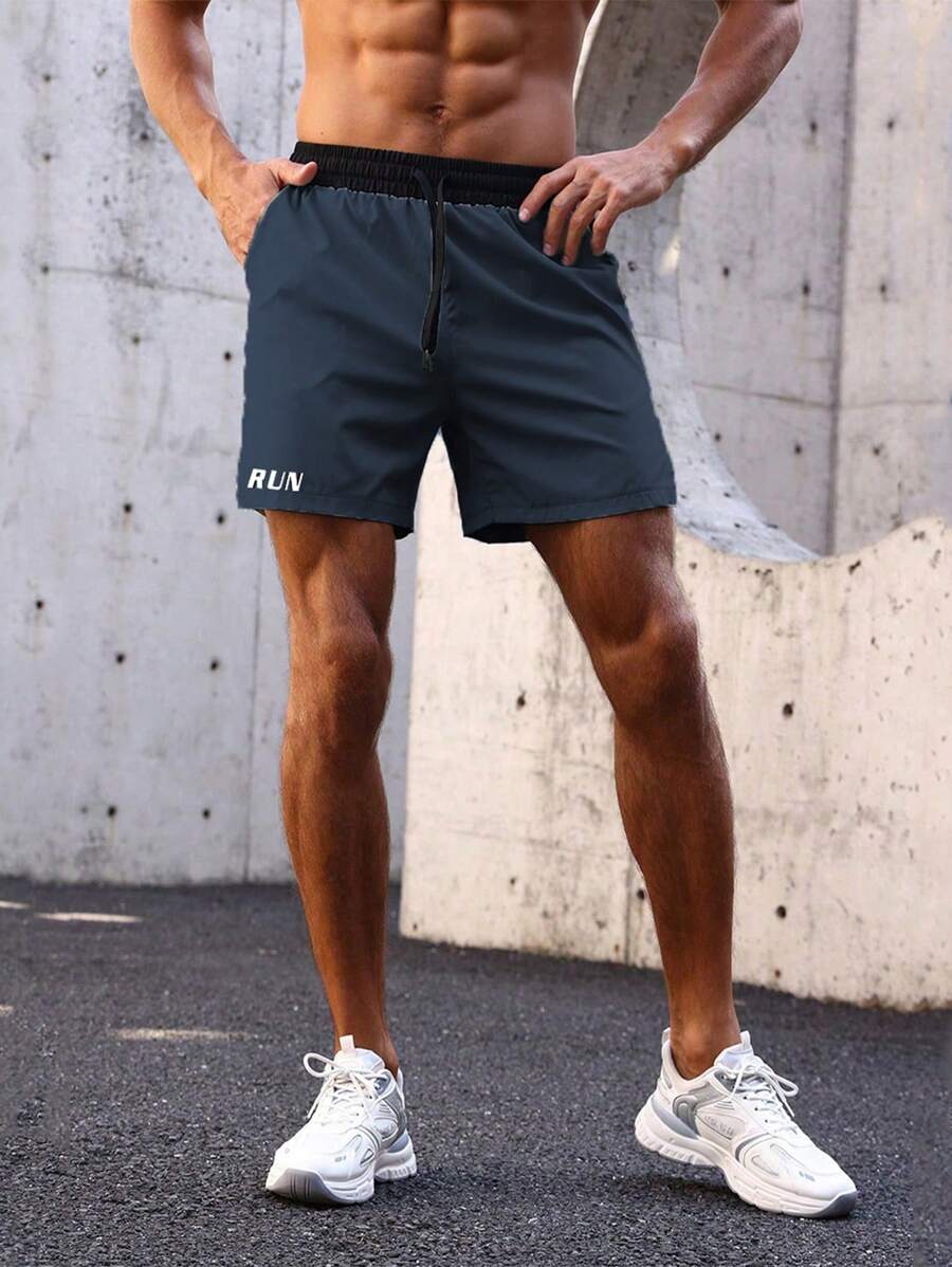 Shorts de sport avec taille élastique, poches larges et inscription