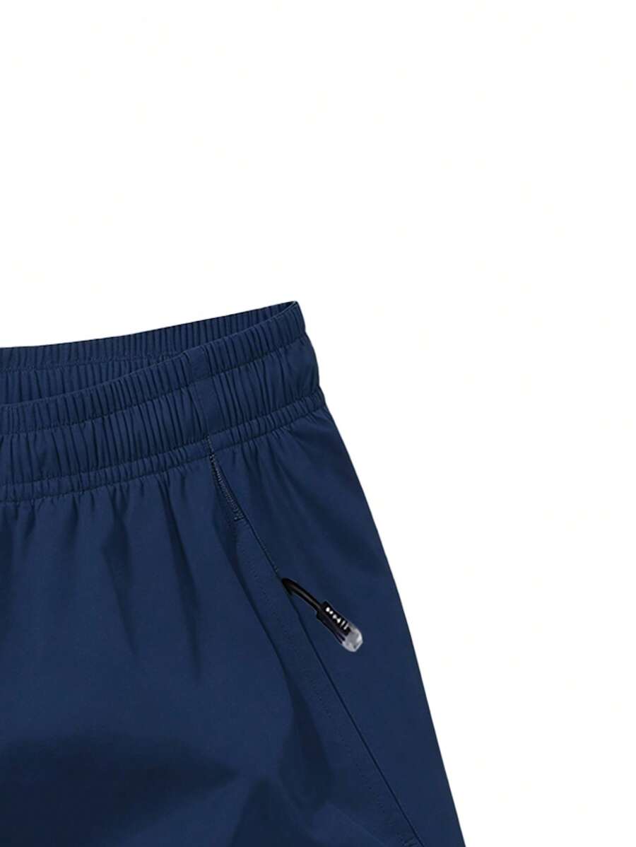 Shorts de sport taille élastique avec poches zippées et cordon