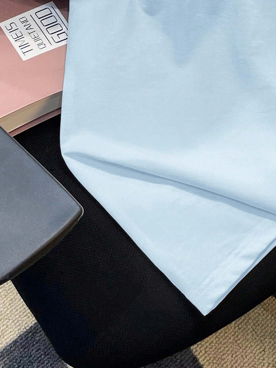Chemise à col rond manches raglan avec imprimé graphique tendance