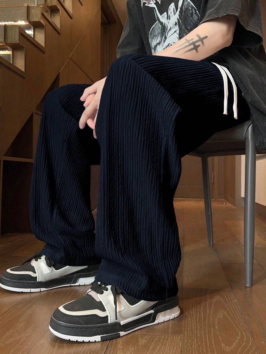 Pantalon droit décontracté en tissu froissé de couleur unie pour homme