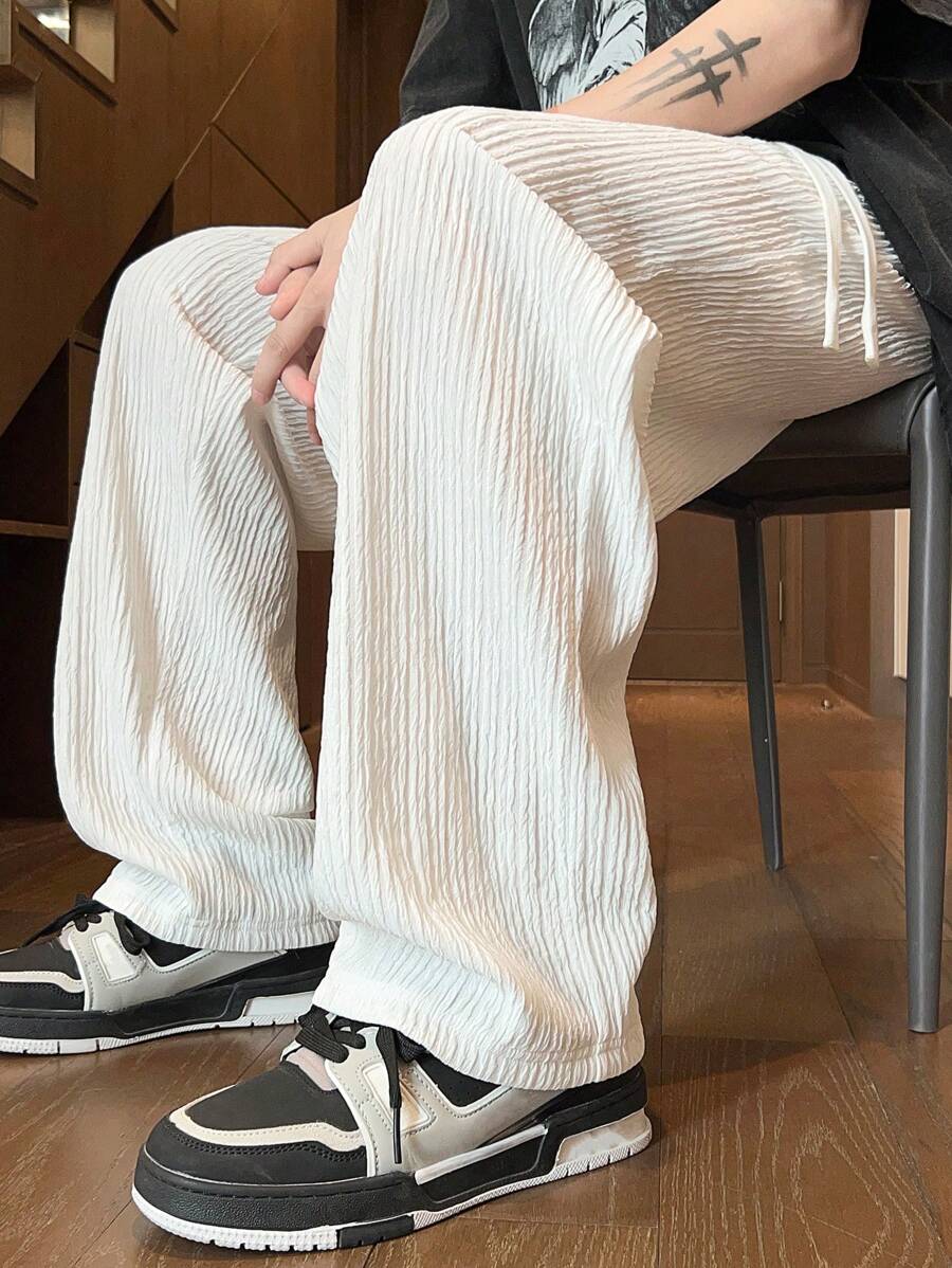 Pantalon droit décontracté en tissu froissé de couleur unie pour homme