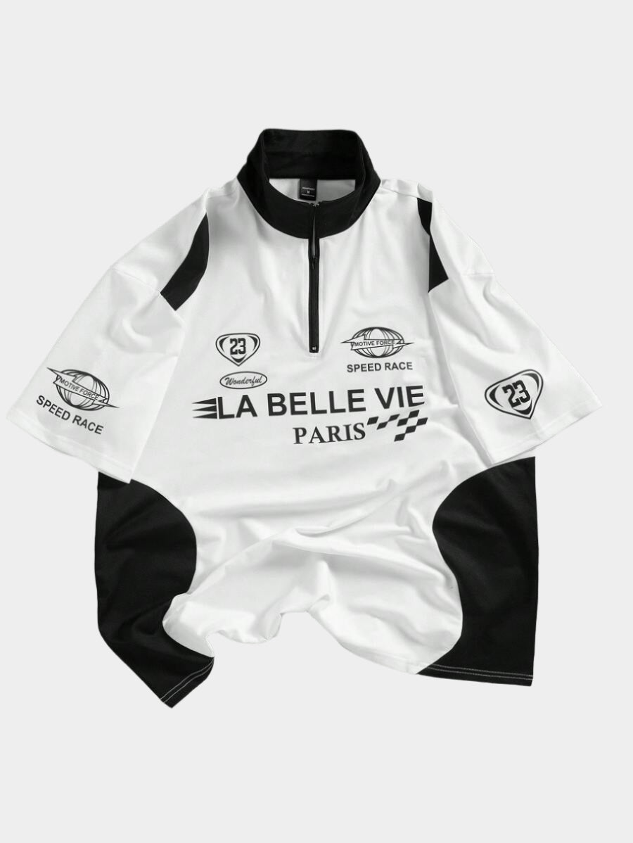 Polo uni avec patchwork, fermeture éclair sur le devant et motif graphique