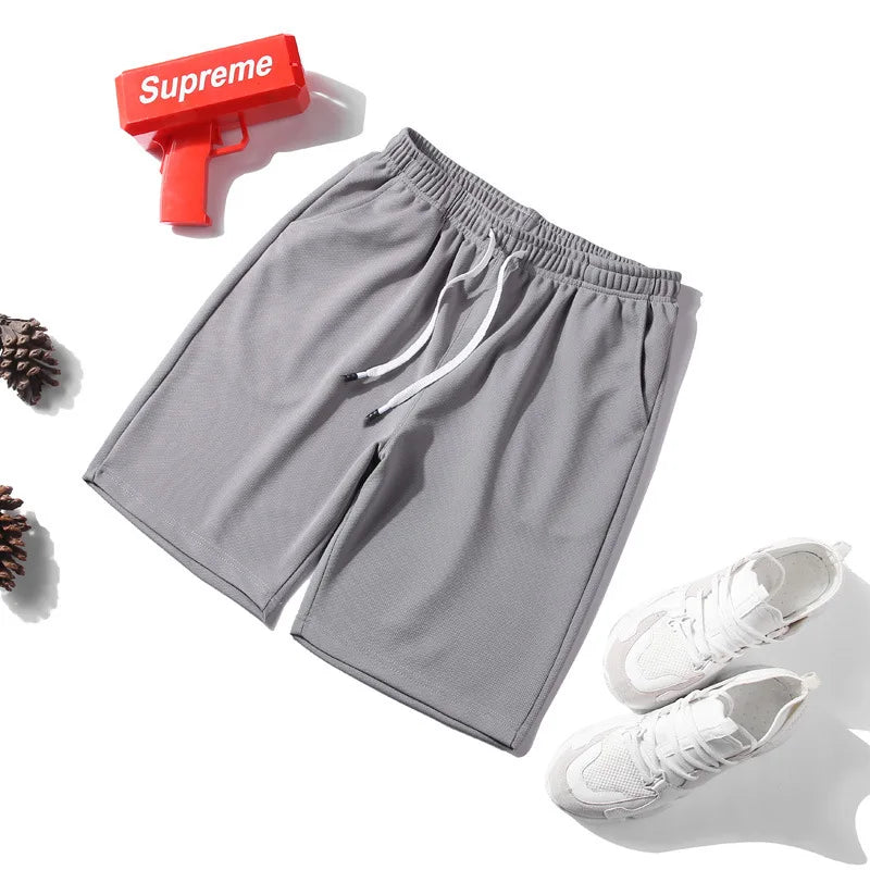 Short de sport à taille élastique et séchage rapide avec maille pour homme