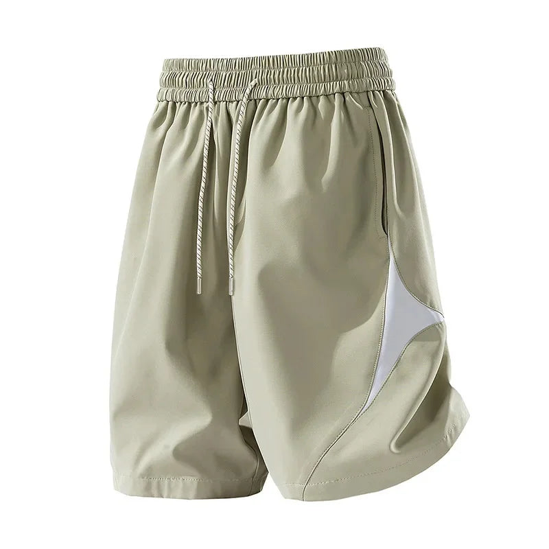 Short de sport décontracté à séchage rapide et coupe ample avec motif color block