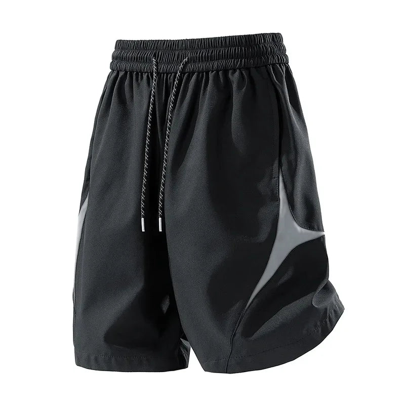 Short de sport décontracté à séchage rapide et coupe ample avec motif color block